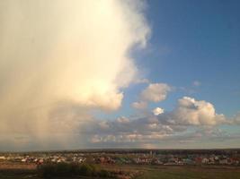 Huge clouds over the village. Sky before rain. photo