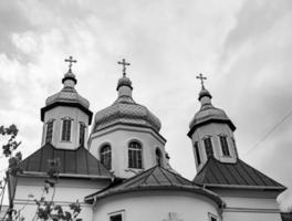 Christian church cross in high steeple tower for prayer photo