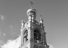 Christian church cross in high steeple tower for prayer photo