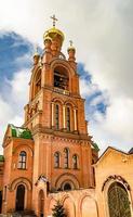 Christian church cross in high steeple tower for prayer photo