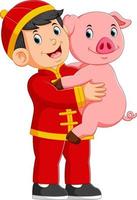 a little boy Is playing with a pig in the chinese new year vector