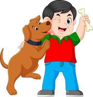 A boy holding bone with his dog vector