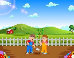 Boy and Girl planting tree in the park