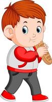 un niño con una gran barra de pan vector