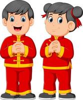 two children are giving a greeting for a chinese's new year vector