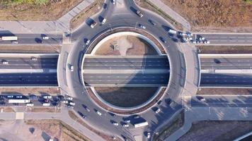 Aerial top down view of cars moving along the road junction. video