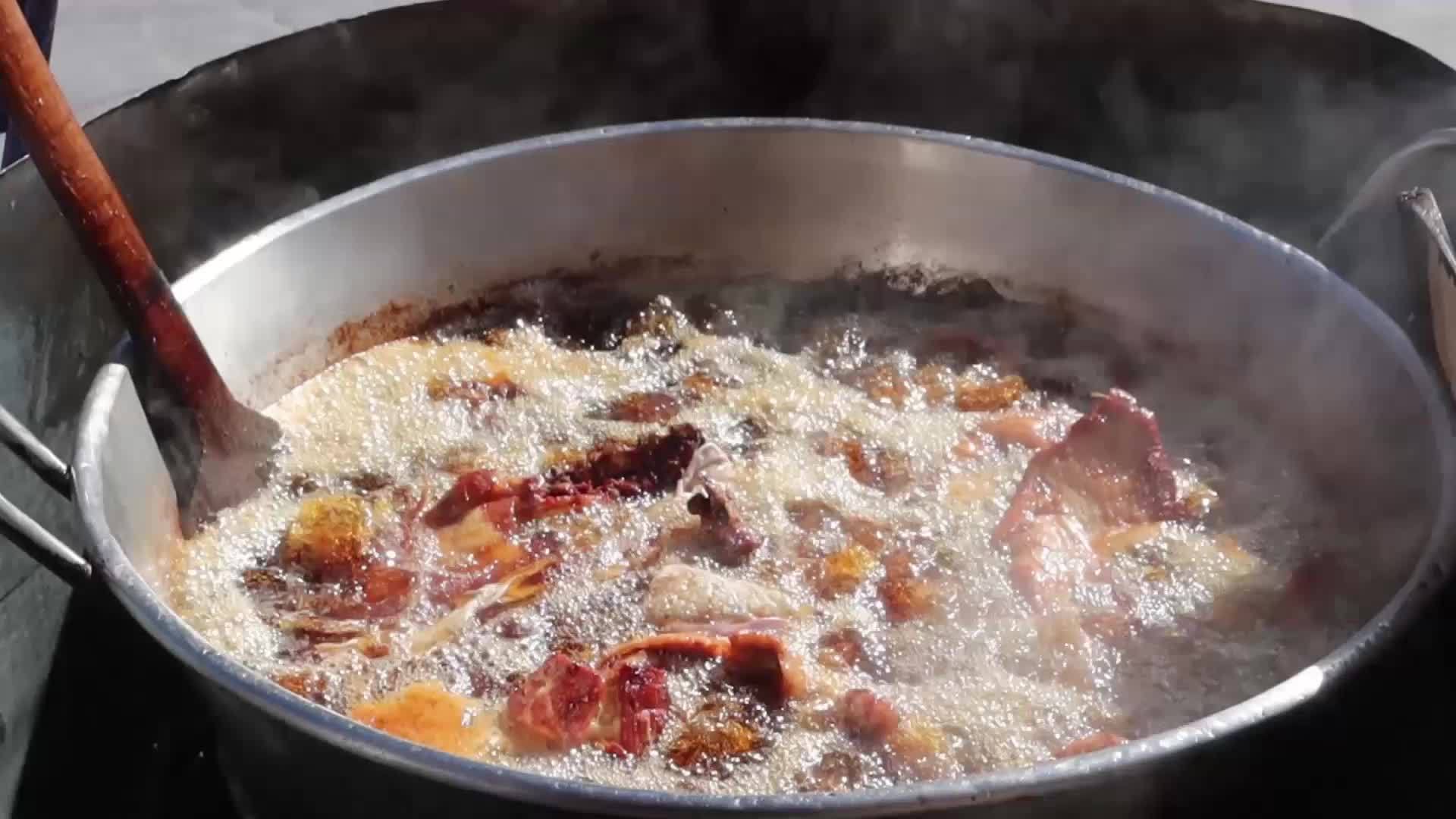 Saucepan with pork carnitas frying in lard in Mexico 13802282 Stock