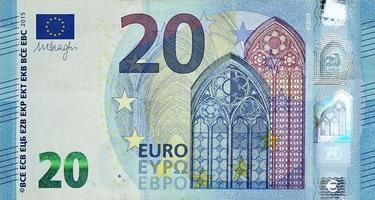 Fragmento de un primer plano de un billete de 20 euros con pequeños detalles azules foto