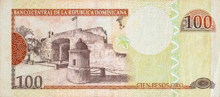 Puerta Del Conde building depicted on old one hundred peso note Dominican republic money photo