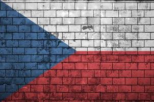 Czech flag is painted onto an old brick wall photo