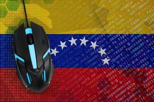 Venezuela flag and computer mouse. Digital threat, illegal actions on the Internet photo