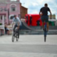 Defocused image of a lot of people with bmx bikes. Meeting of fans of extreme sports photo