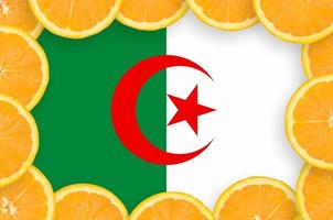 Algeria flag in fresh citrus fruit slices frame photo