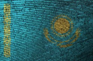 Kazakhstan flag is depicted on the screen with the program code. The concept of modern technology and site development photo