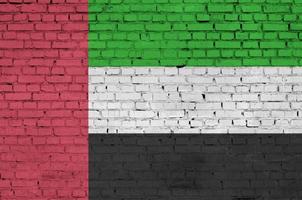 United Arab Emirates flag is painted onto an old brick wall photo