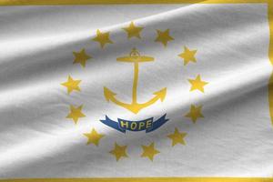 Rhode Island US state flag with big folds waving close up under the studio light indoors. The official symbols and colors in banner photo