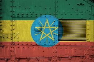 Ethiopia flag depicted on side part of military armored tank closeup. Army forces conceptual background photo