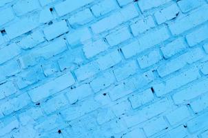 Square brick block wall background and texture. Painted in blue photo