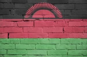 Malawi flag is painted onto an old brick wall photo