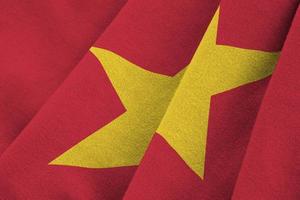 Vietnam flag with big folds waving close up under the studio light indoors. The official symbols and colors in banner photo