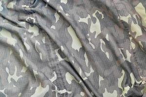 Camouflage background texture as backdrop for military video games and design projects photo