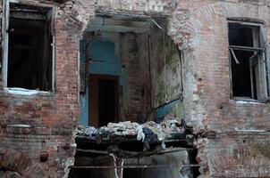 Fragment of an abandoned two-story building after military operations in Donetsk photo