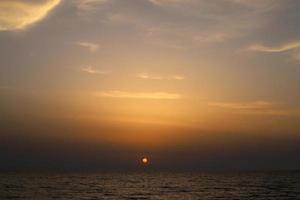 The sun sets below the horizon on the Mediterranean Sea in northern Israel. photo