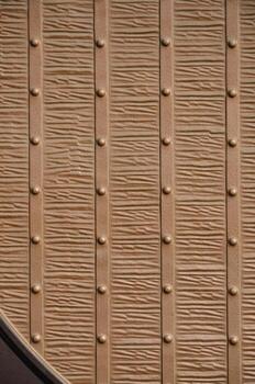 The texture of the fragment of the ancient bronze gate photo