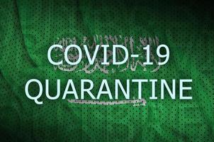 Saudi Arabia flag and Covid-19 quarantine inscription. Coronavirus or 2019-nCov virus photo