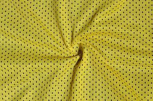 Texture of sportswear made of polyester fiber. Outerwear for sports training has a mesh texture of stretchable nylon fabric photo