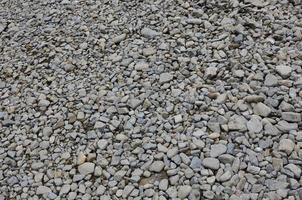 Texture of many crushed stones. Crushed stone is a solid base material for foundation photo
