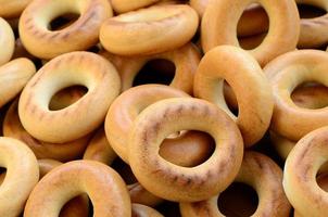 Close-up photo of fresh yellow bagels. A popular kind of flour products. One of the traditional Russian treats for tea