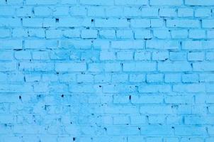 Square brick block wall background and texture. Painted in blue photo