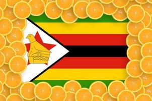 Zimbabwe flag in fresh citrus fruit slices frame photo