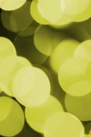 Bokeh effect golden yellow defocused light background. Christmas Lights Concept photo