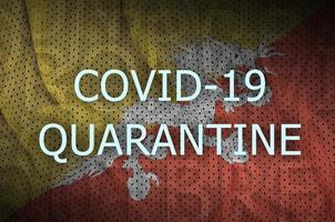 Bhutan flag and Covid-19 quarantine inscription. Coronavirus or 2019-nCov virus photo