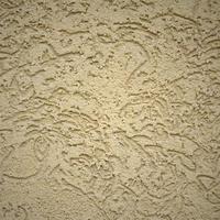 The texture of the beige decorative plaster in bark beetle style photo