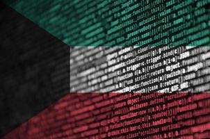 Kuwait flag is depicted on the screen with the program code. The concept of modern technology and site development photo
