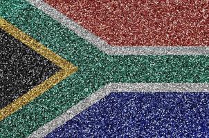 South Africa flag depicted on many small shiny sequins. Colorful festival background for party photo