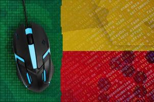 Benin flag and computer mouse. Digital threat, illegal actions on the Internet photo