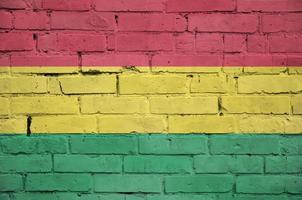 Bolivia flag is painted onto an old brick wall photo