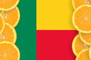Benin flag in citrus fruit slices vertical frame photo