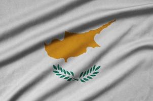 Cyprus flag is depicted on a sports cloth fabric with many folds. Sport team banner photo