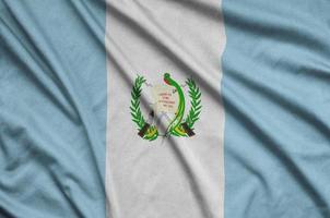 Guatemala flag is depicted on a sports cloth fabric with many folds. Sport team banner photo