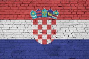 Croatia flag is painted onto an old brick wall photo