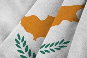 Cyprus flag with big folds waving close up under the studio light indoors. The official symbols and colors in banner photo