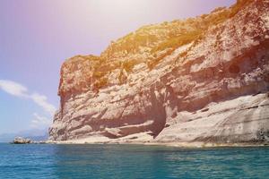 Landscape of Turkey natural rock mountains over blue sea water photo