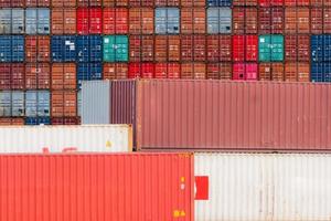 Stack of logistics container. Cargo and shipping business. Container ship for export logistics. Logistic industry. Container for truck, ship, and air logistics. Container depot service and transport. photo