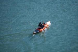 Bilbao, Vizcaya, Spain, 2022 - athlete in canoe on the Nervion river in Bilbao city, Basque country, spain photo