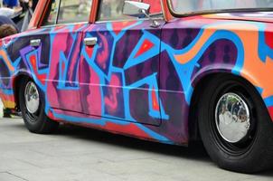 KHARKOV, UKRAINE - MAY 27, 2017 Festival of street art. A car that was painted by masters of street art during the festival. The result of the work of several graffiti artists. Original aerography photo